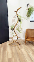 Porte-plantes serpent en rotin